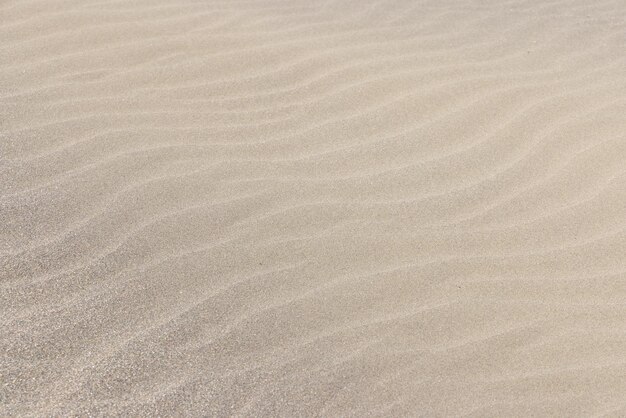 Foto textura de padrão de praia de areia marinha