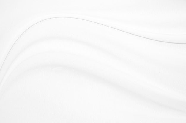 Textura de pano de luxo suave e elegante de seda branca ou cetim pode ser usada como fundo de casamento Design de fundo luxuoso