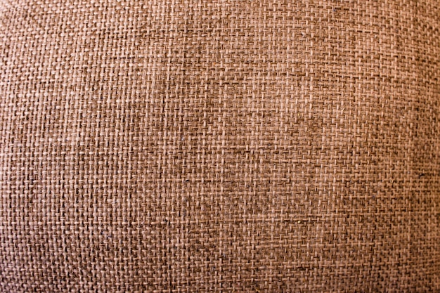 Textura de pano rústico. Vista superior do fundo abstrato. Cenário de tecido marrom com espaço livre, material têxtil colorido closeup