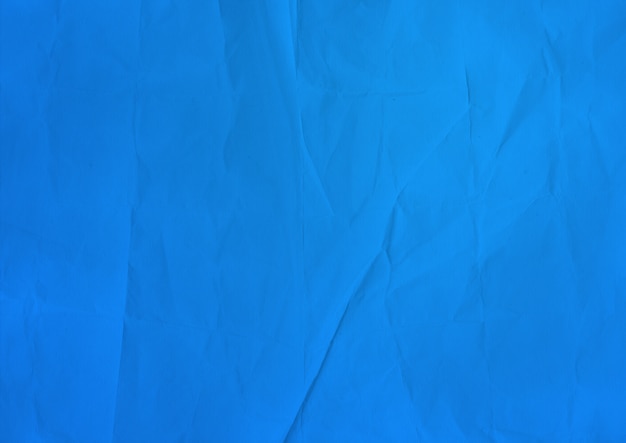 Foto textura de papel amassado azul
