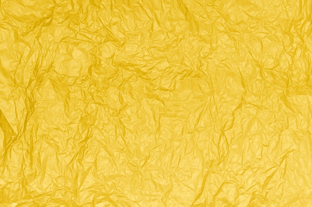 Textura de papel amassado ou fundo amarelo abstrato