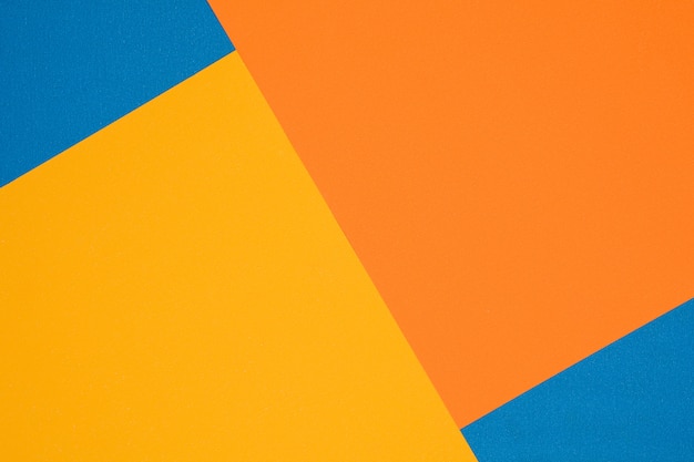 Textura de papel azul, laranja e amarelo