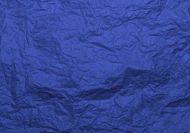 Foto textura de papel de cor azul artesanal amassada para plano de fundo