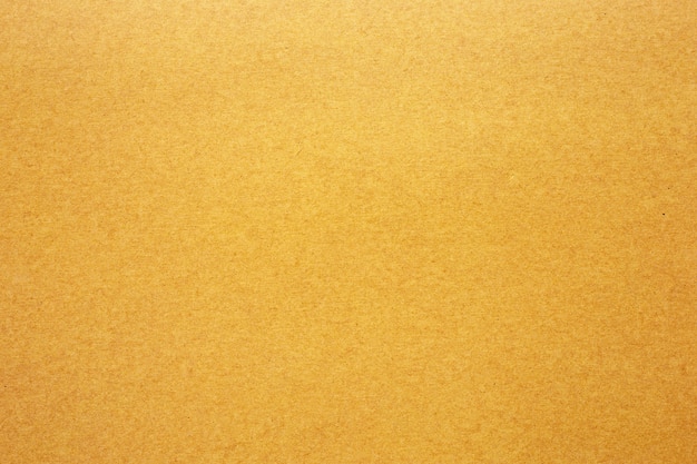 Textura de papel ou papelão amarelo para a superfície