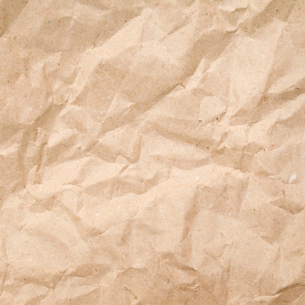 Textura de papel pardo amassado, papel de fundo velho e áspero, close-up de papelão