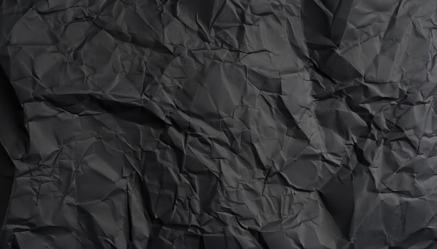 Foto textura de papel preto pesado e arrugado em fundo de pouca luz