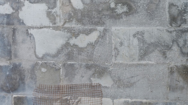 Textura de parede de cimento velha para o fundo