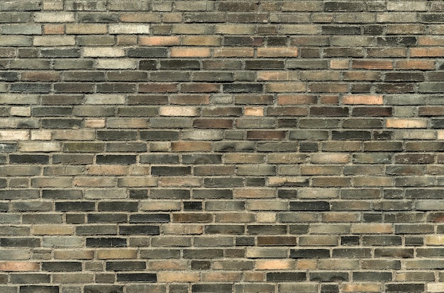 Foto textura de parede de tijolo escuro. fundo de alvenaria