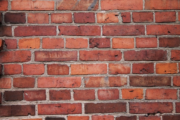 Textura de parede de tijolo vermelho escuro de um castelo medieval