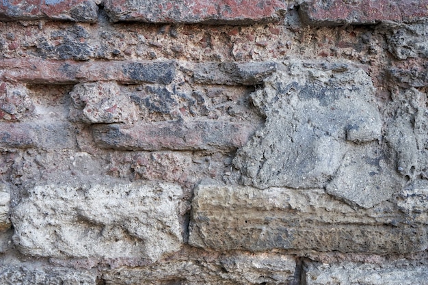 Textura de parede de tijolos de pedra velha.