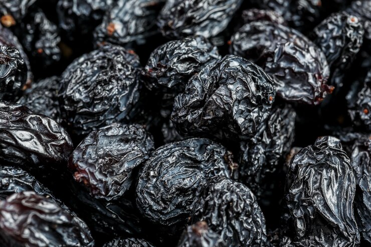 Textura de passa preta, frutos secos populares. Uvas secas.