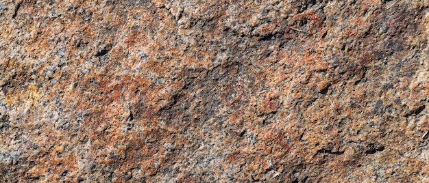 Textura de pedra de granito rachado. Superfície de rocha de granito. Cenário de pedra natural. Copie o espaço