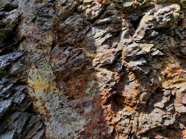 Textura de pedra geodésica A rocha é marrom e vermelha Fundo mineral Design de materiais naturais