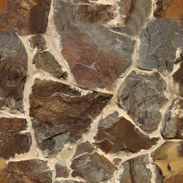 Textura de pedra sem costura feita de diferentes pedras Padrão sem costura para fins de design exterior