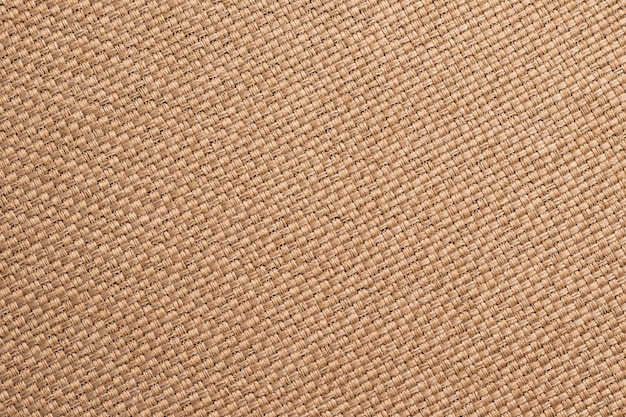 Textura de serapilheira, marrom tecido fundo da tela. Superfície de saco de carvão, material de demissão, close-up de papel de parede de têxteis.