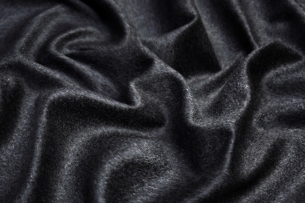 Textura de tecido cinza escuro elegante e suave como fundo abstrato para design de padrão luxuoso