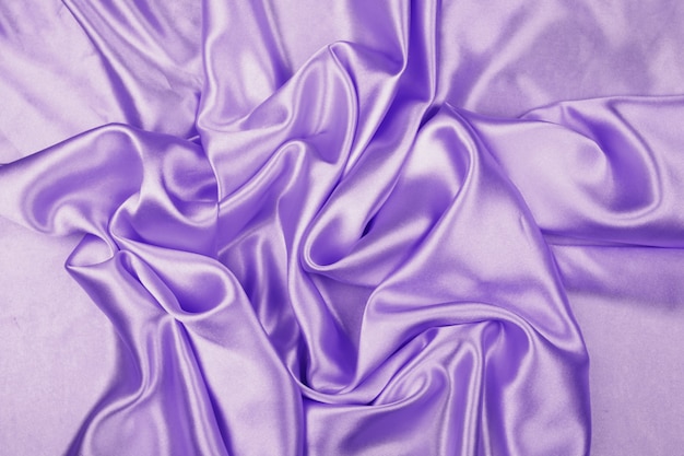 Textura de tecido de cetim de luxo roxo para plano de fundo