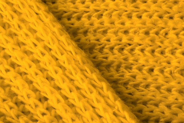 Textura de tecido de malha amarelo macio como pano de fundo