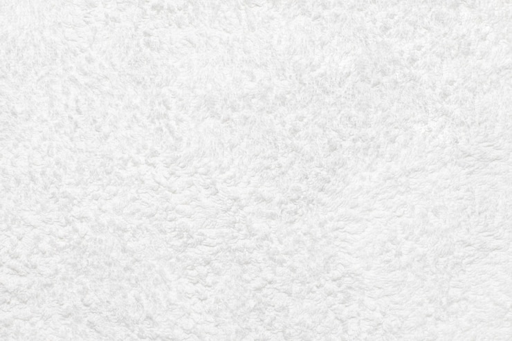 Foto textura de tecido de toalha branca close-up. o plano de fundo para sua maquete