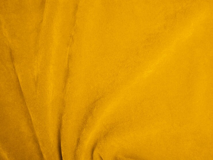 Textura de tecido de veludo amarelo usado como fundo Fundo de tecido amarelo vazio de material têxtil macio e liso Há espaço para texto