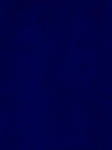 Foto textura de tecido de veludo azul escuro usado como fundo fundo de tecido azul vazio de material têxtil macio e liso há espaço para texto