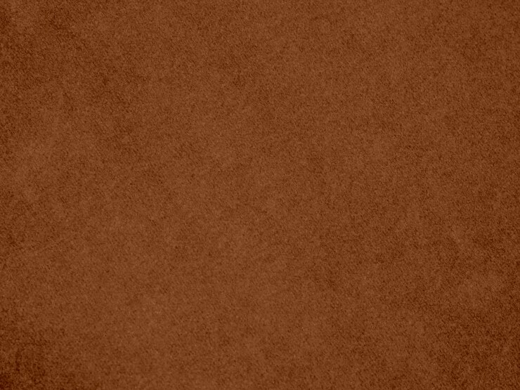 Foto textura de tecido de veludo de cor marrom usada como fundo fundo de tecido marrom vazio de material têxtil macio e liso há espaço para texto