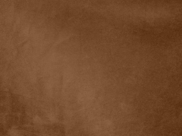 Foto textura de tecido de veludo de cor marrom usada como fundo fundo de tecido marrom vazio de material têxtil macio e liso há espaço para textx9