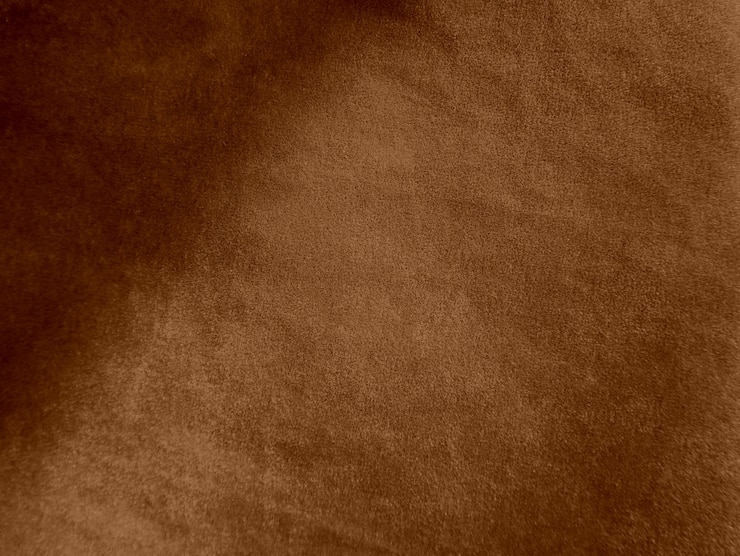 Foto textura de tecido de veludo de cor marrom usada como fundo fundo de tecido marrom vazio de material têxtil macio e liso há espaço para textx9