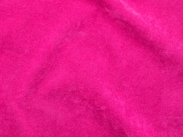 Textura de tecido de veludo rosa usada como plano de fundo Fundo de tecido rosa vazio de material têxtil macio e liso Há espaço para texto