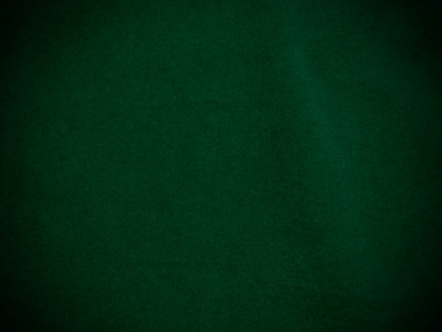 Textura de tecido de veludo verde escuro usado como fundo Fundo de tecido verde vazio de material têxtil macio e liso Há espaço para texto