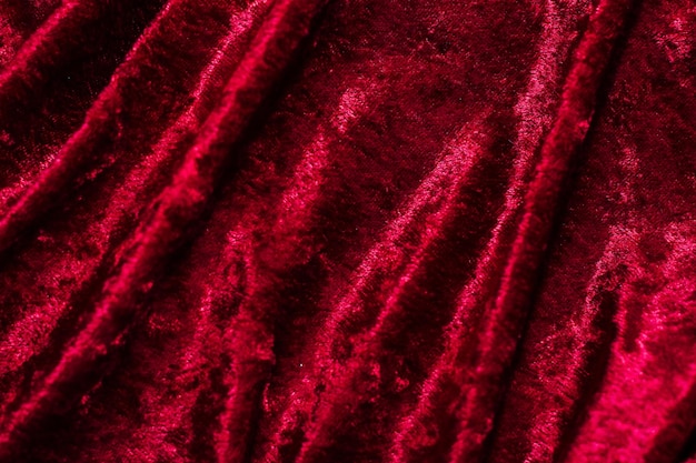 Textura de tecido de veludo vermelho com dobras