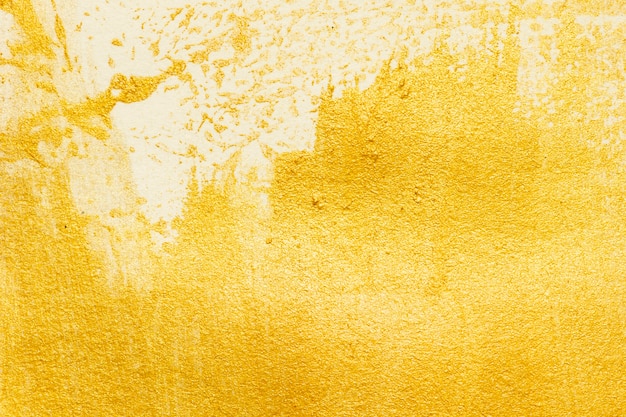 Textura de tinta acrílica dourada em fundo de papel branco