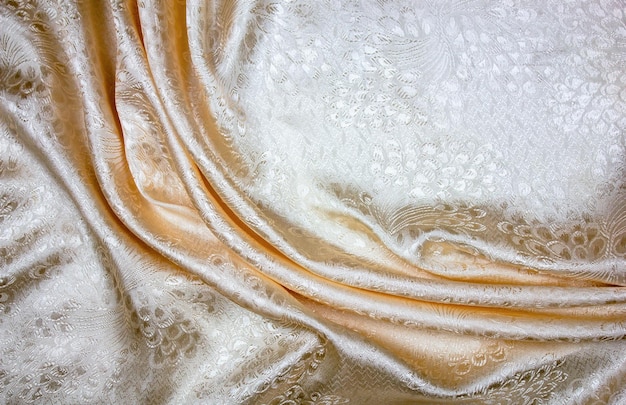 Textura de tom pastel de cetim leve Padrão de dobra de onda delicada de tecido de cetim de seda de alta definição