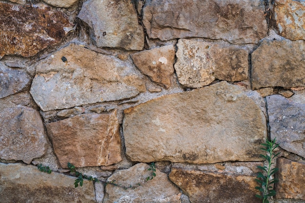 Foto textura de um antigo muro de pedra natural