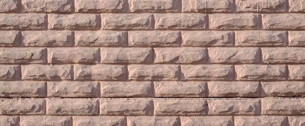 Foto textura de um muro de concreto de relevo de cor bege