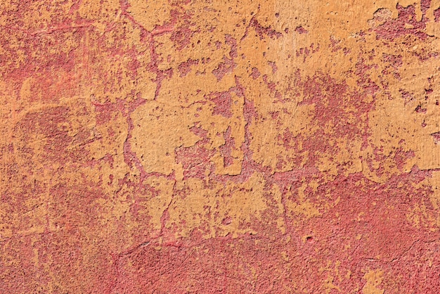 Textura de uma parede de concreto com rachaduras e arranhões que podem ser usados como pano de fundo