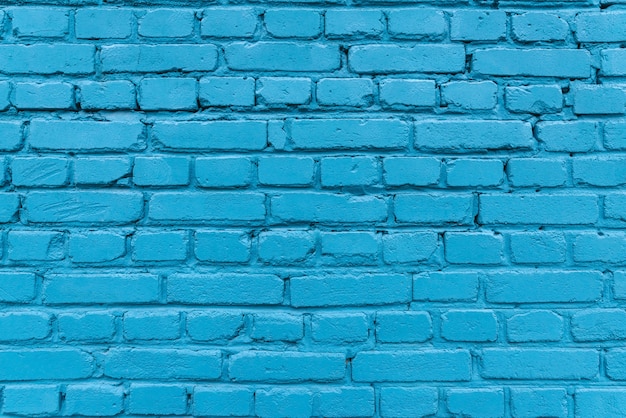 Textura de uma parede de tijolo azul de uma casa.