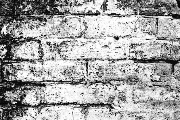 Textura de uma parede de tijolos com rachaduras e arranhões que podem ser usados como pano de fundo