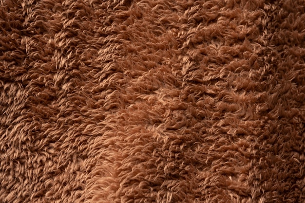 Textura de uma pelagem artificial castanha como fundo