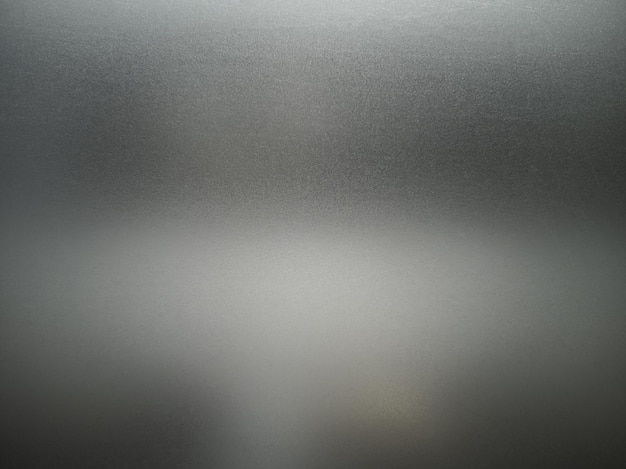 Foto textura de vidro cinza fosco. sombra escura por trás.