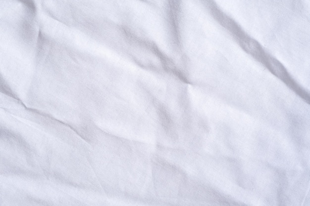 Foto textura degradada de ropa de cama blanca estilo de curva borrosa de tela de lujo abstracta ropa de cama arrugada y fondo de sombras gris oscuro