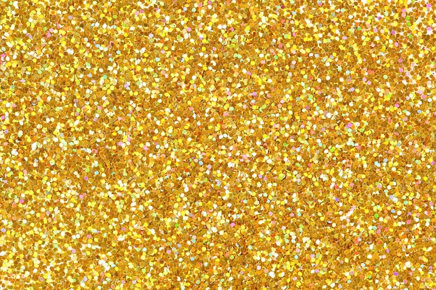 Textura detallada de la superficie de polvo dorado brillante. Foto de alta resolución.