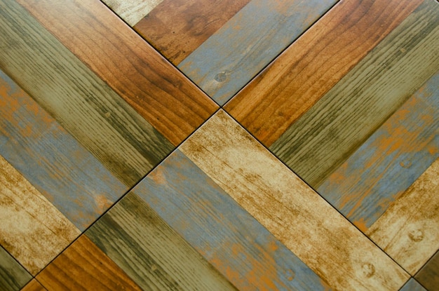 Textura de diferentes tableros abigarrados colocados en diagonal Suelo laminado de parquet de esquina de fondo