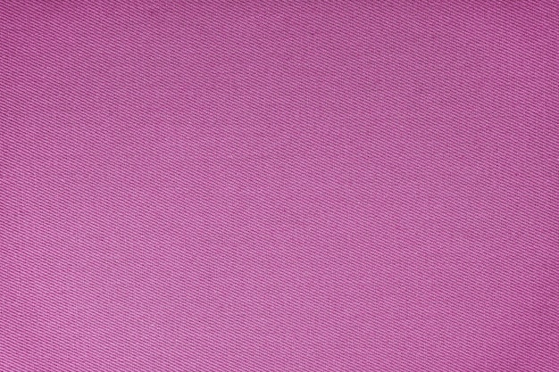 Textura do padrão de tecelagem diagonal de tecido roxo Fundo têxtil decorativo