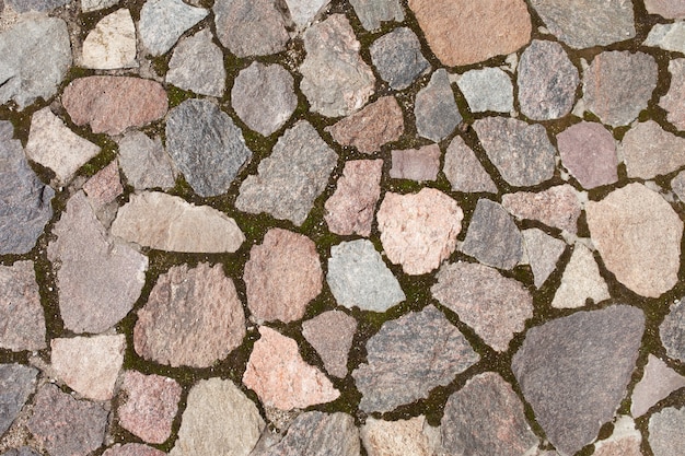 Textura do pavimento de pedra, ladrilhos de paralelepípedos, fundo de tijolos