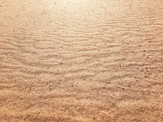 Textura do solo seco com características de ondas exóticas causadas pelo vento soprando na vista superior