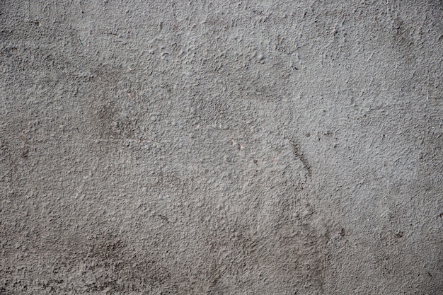 Textura do velho muro de concreto cinza.