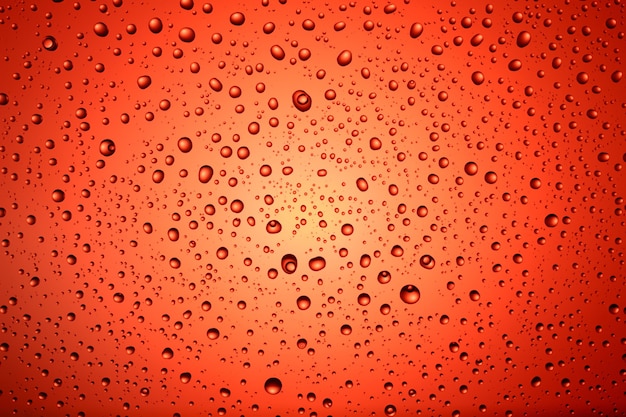 Foto textura e fundo de gotas de água em um fundo colorido