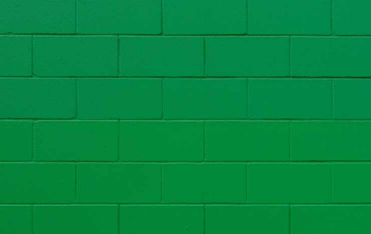 Foto textura e fundo de parede de tijolo pintado verde