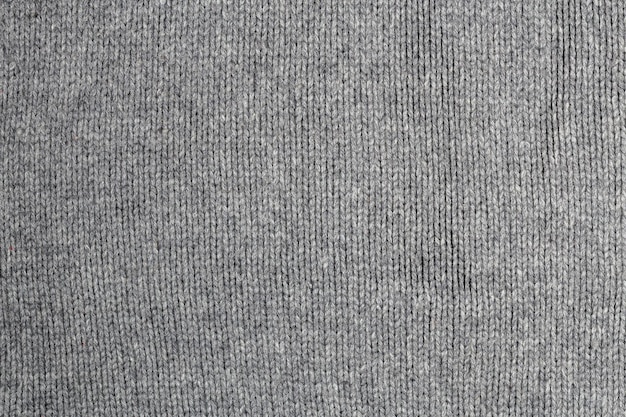 Textura e fundo de suéter de lã quente cinza velha
